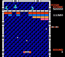Arkanoid screenshot of the futuristic floating paddle paddling balls towards blocks and enemies