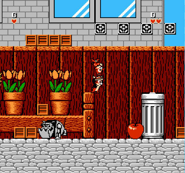 Chip N Dale Rescue Rangers screenshot amidst flowers and robot dogs where Chip is happily carrying around Dale, totally not intending to throw him at an enemy or off a cliff