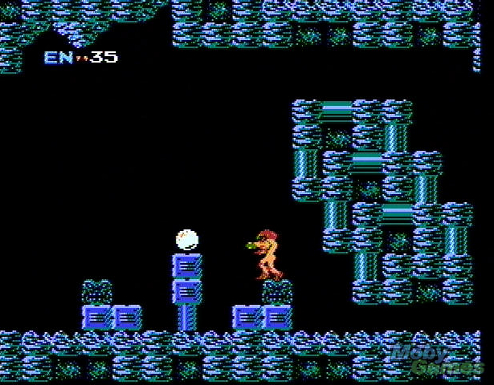 Metroid screenshot where Samus Aran gazes longlingly upon her first ever powerup, the morph ball